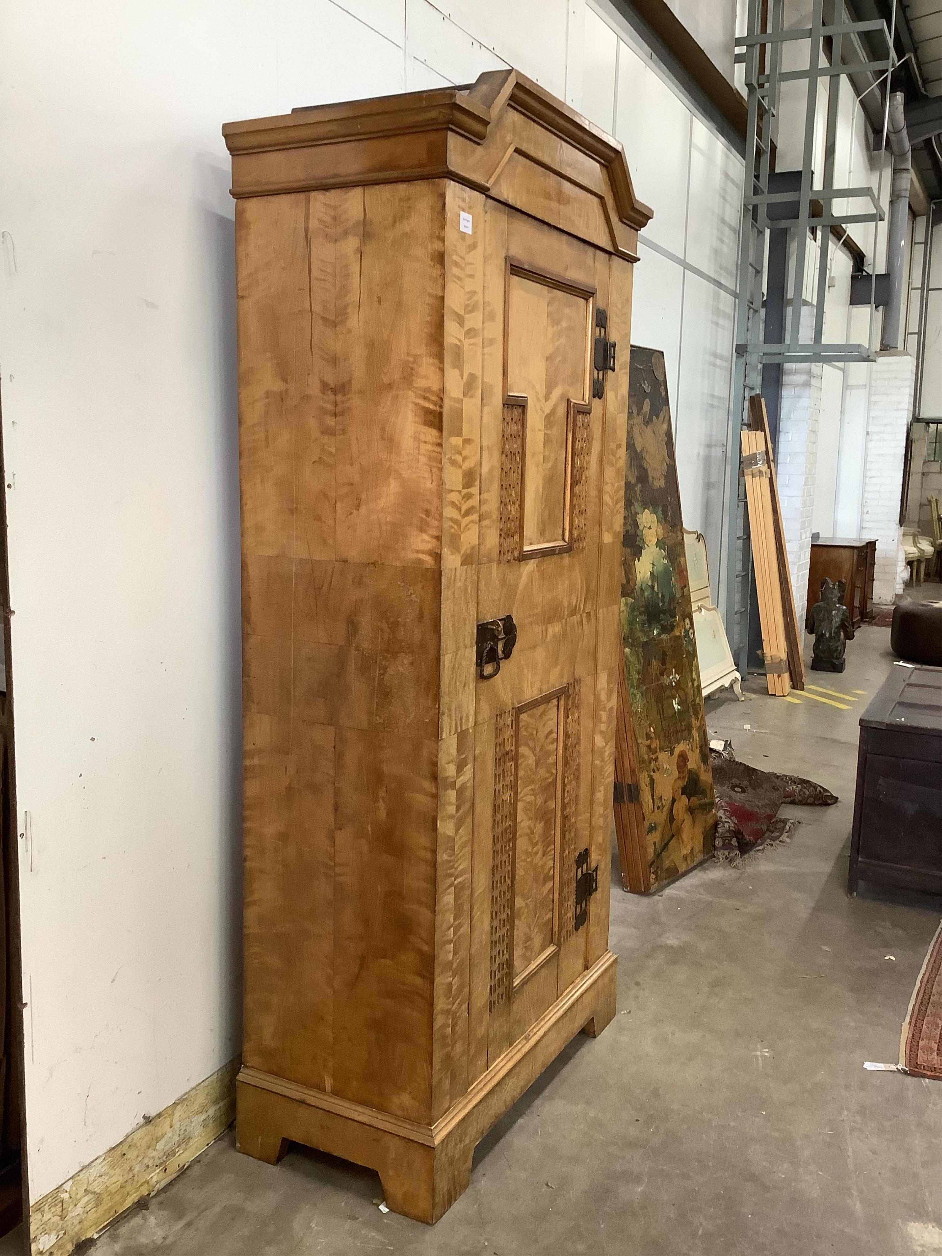 A Swedish birch Arts & Crafts armoire, width 98cm, depth 49cm, height 204cm. Condition - good